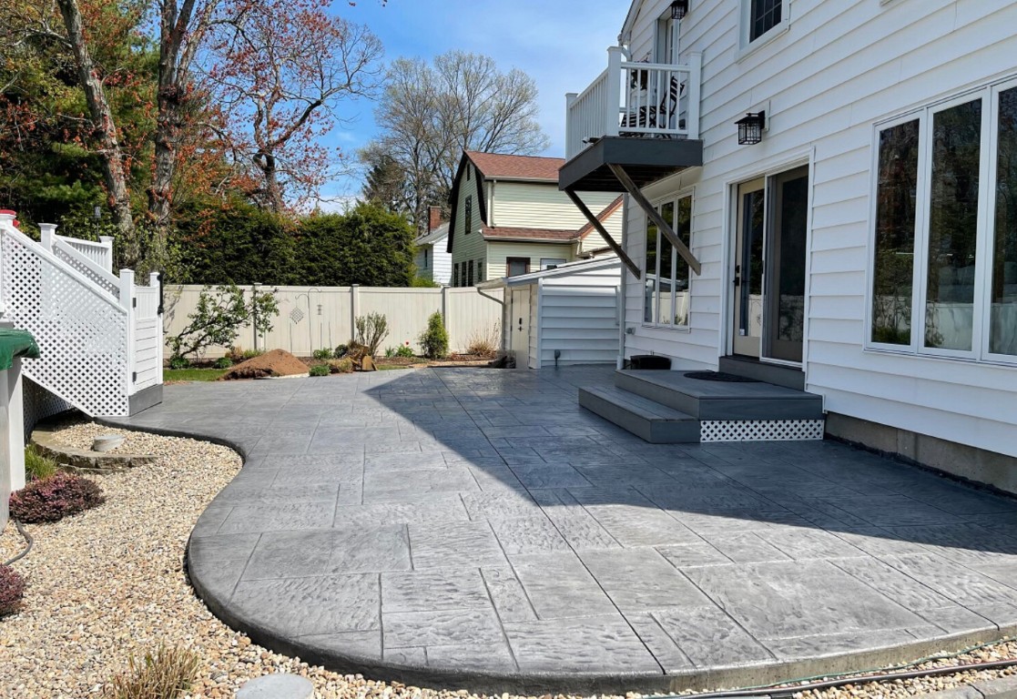 Custom concrete patio transforming backyard in Columbus, IN